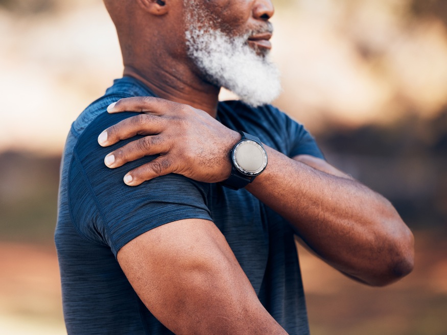 man with pain in his shoulder