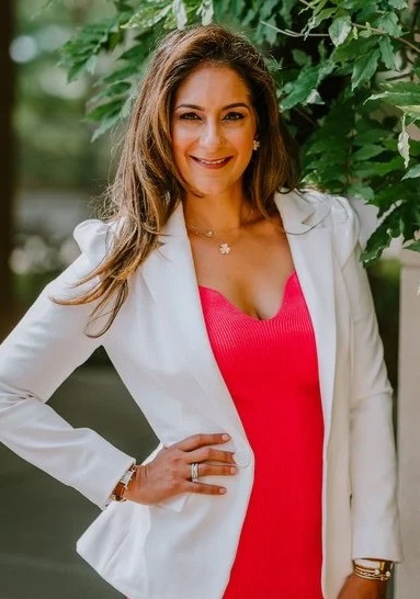 Dr pamela mehta in pink dress and white coat