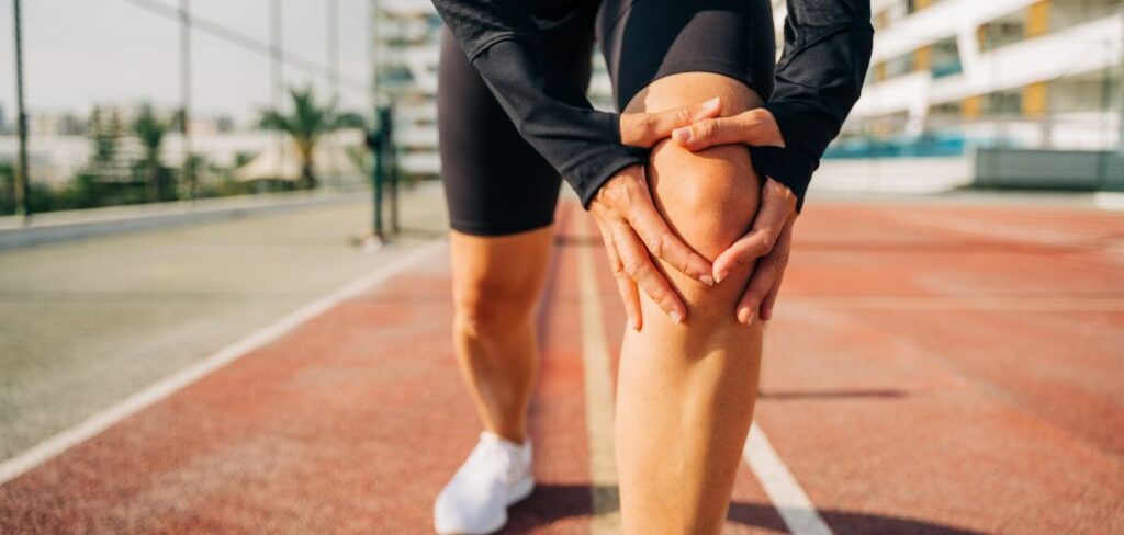 A person doing knee stretches